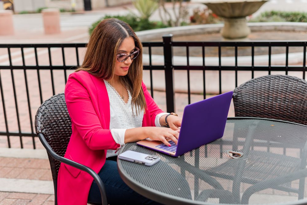 young woman poses for her branding session in downtown Winter Haven, Florida