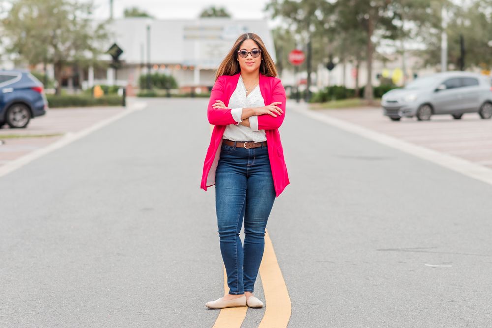 woman posing for branding session on street of downtown Winter Haven, Florida
