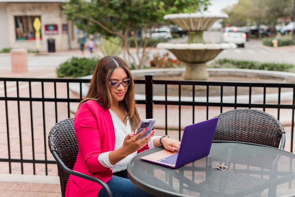 young woman poses for branding session in downtown Winter Haven, Florida