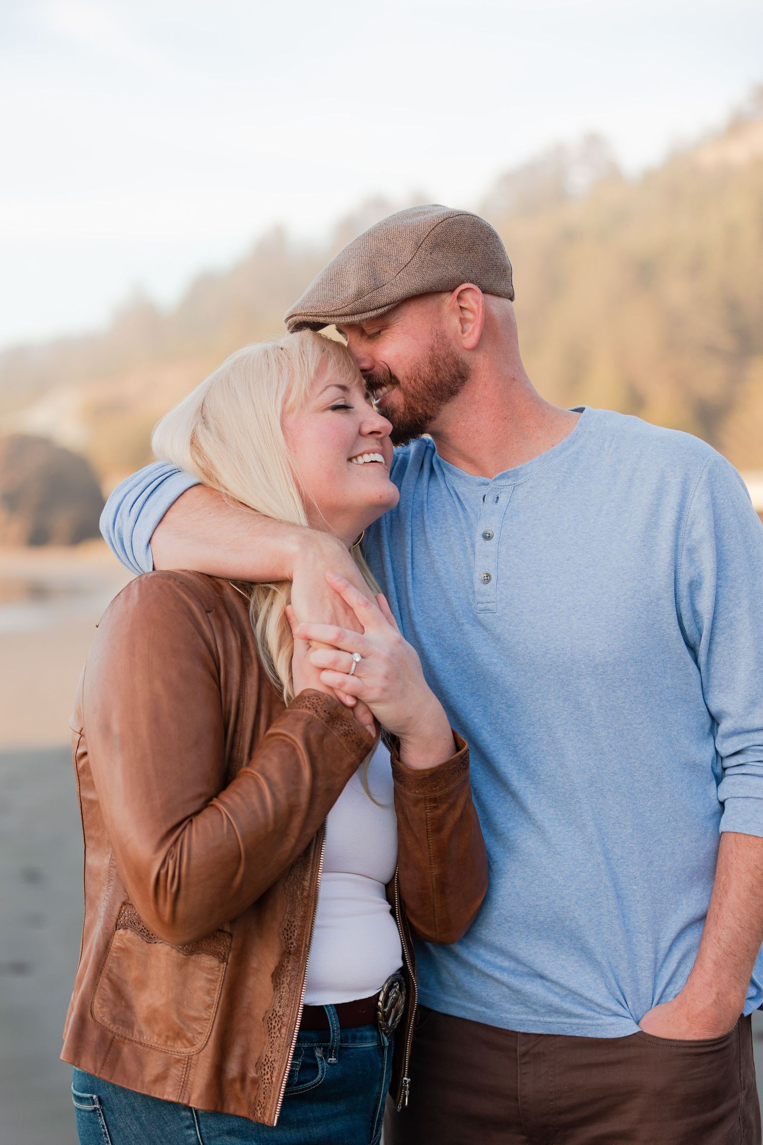 engaged couple smiling blissfully during photoshoot