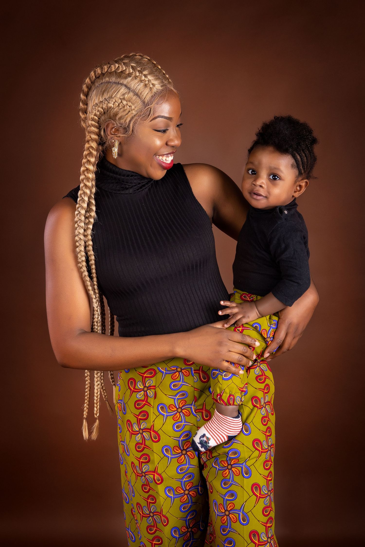Mum with her son in her hands both smiling