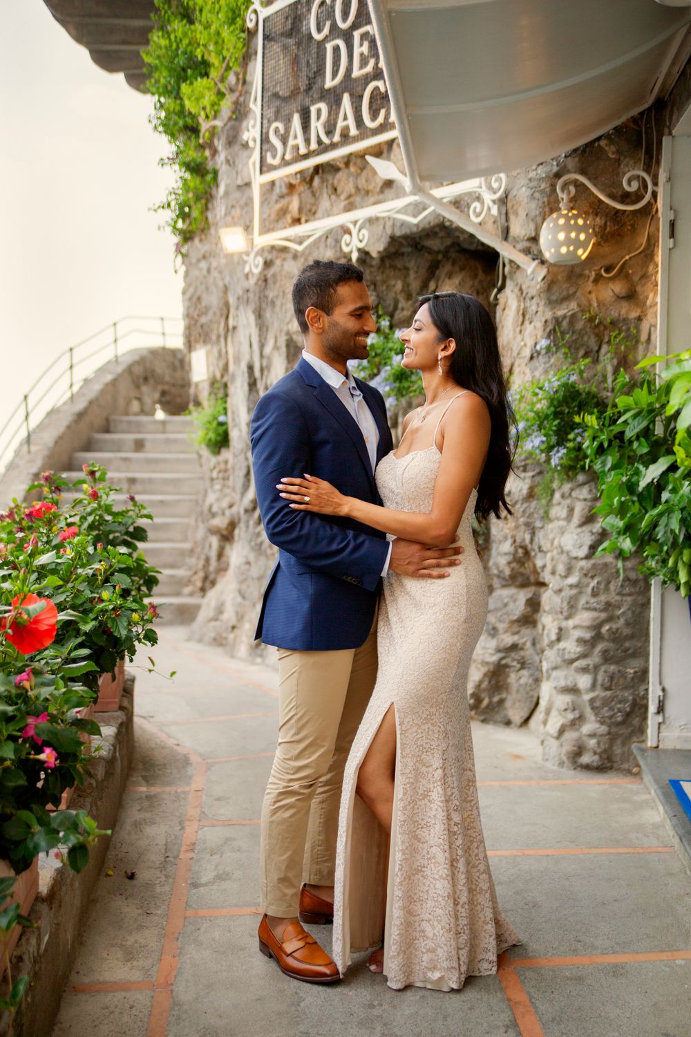 Photo shoot of a surprise proposal on a boat against Amalfi Coast  and Positano background.
