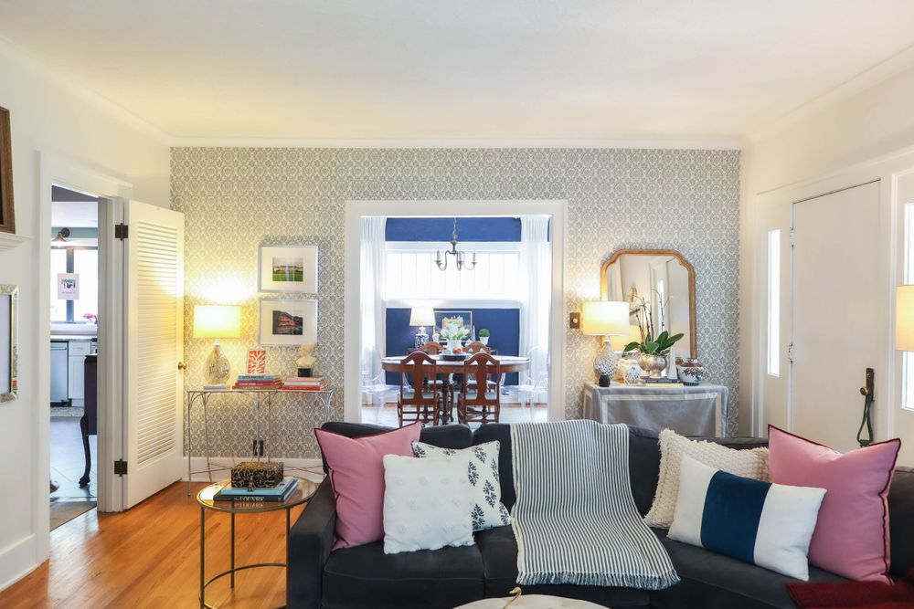 Modern living room interior with white walls and plush seating arrangements.