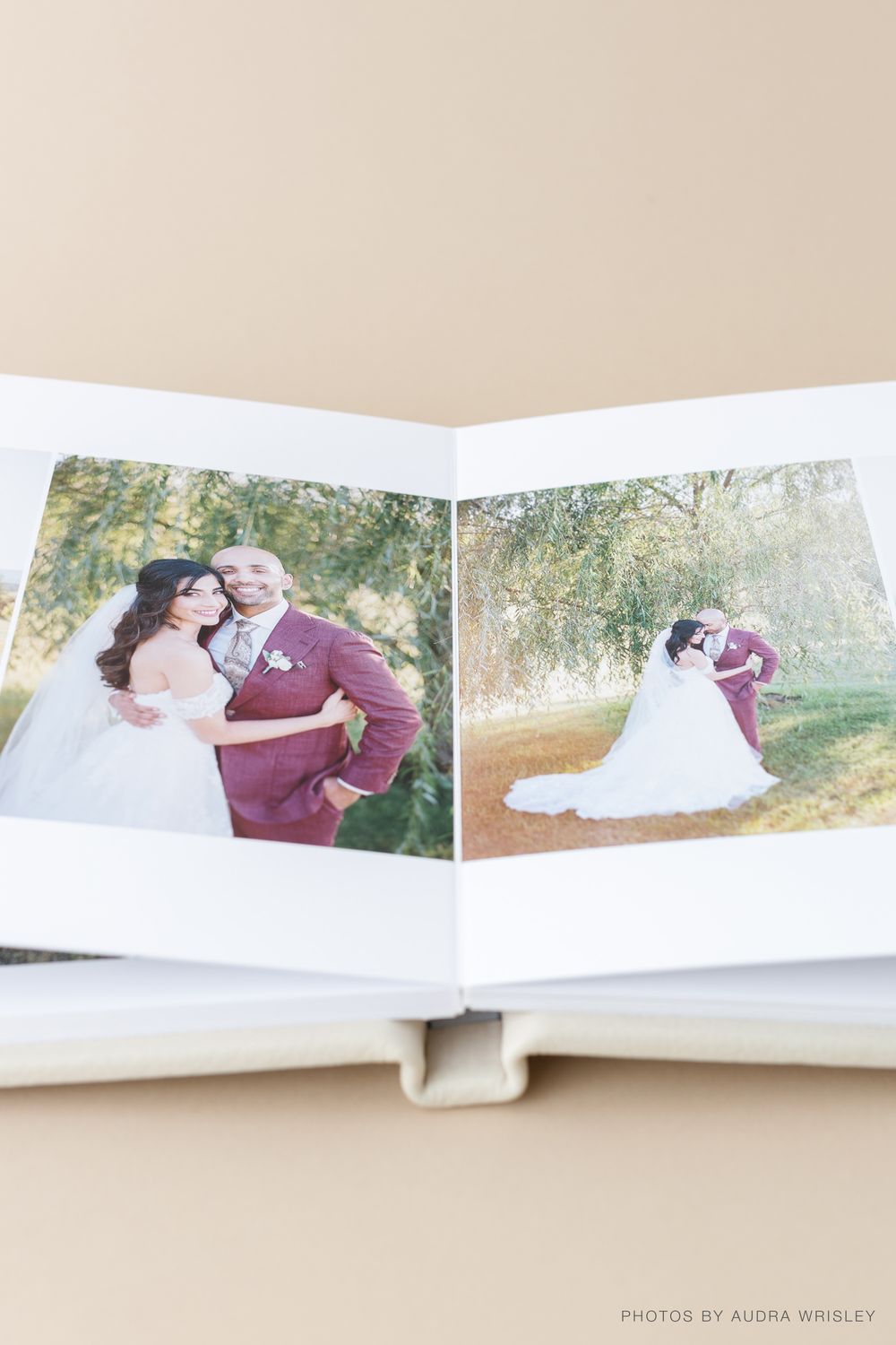 Professional wedding album spread showing outdoor couple portraits in natural settings.