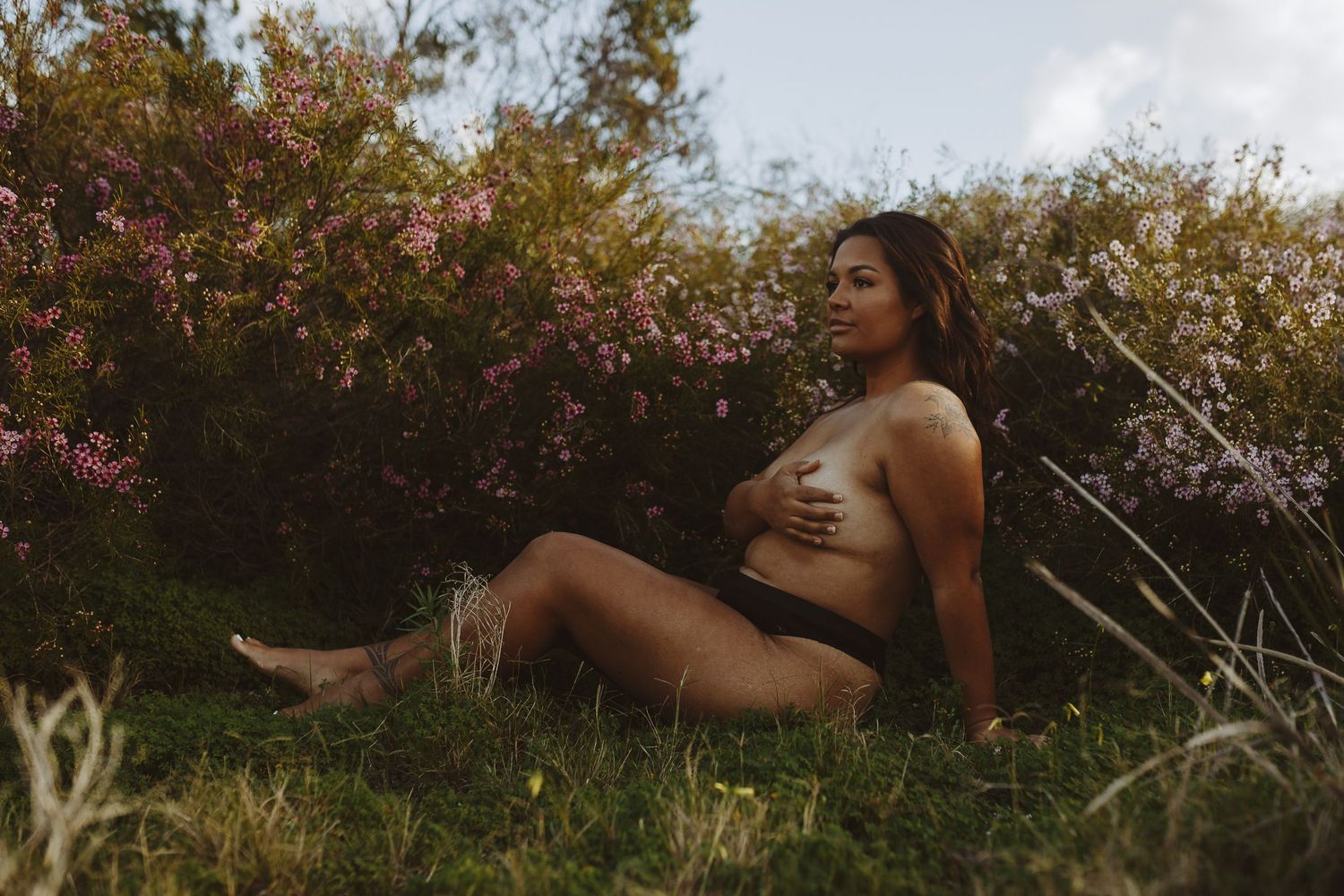 Perth portrait photographer captures confident woman in the native Australian Flowers in City Beach, Western Australia
