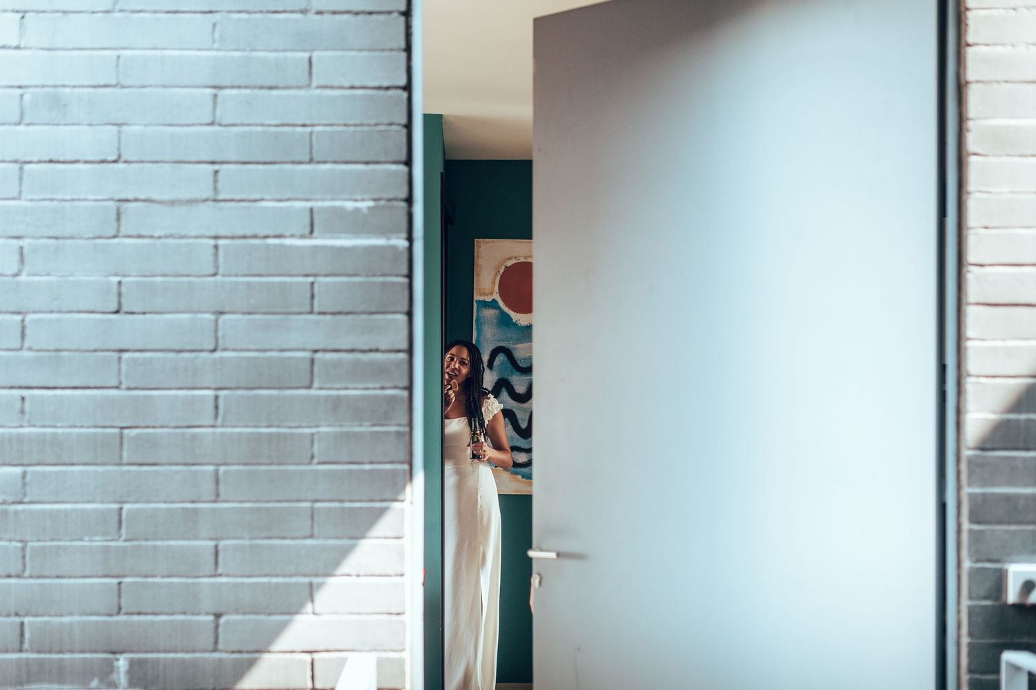 Modern interior space with white painted brick walls and clean minimalist design.