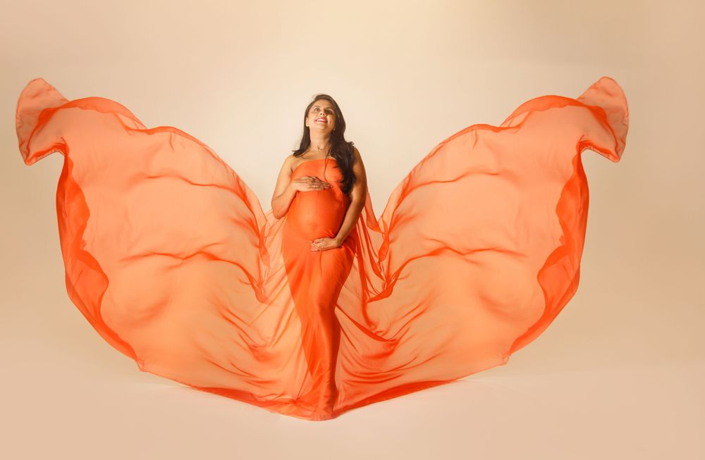 Maternity Photographer in Roswell, GA utilizing fabric drapes