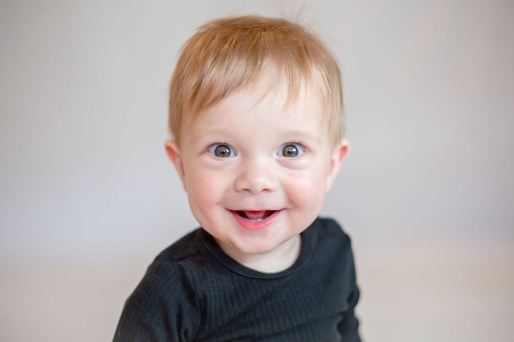 professional photo of little boy smiling at camera