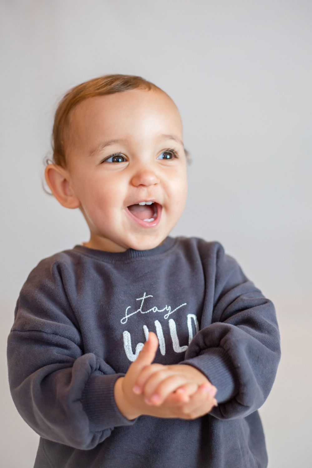professional photo of girl smiling and clapping
