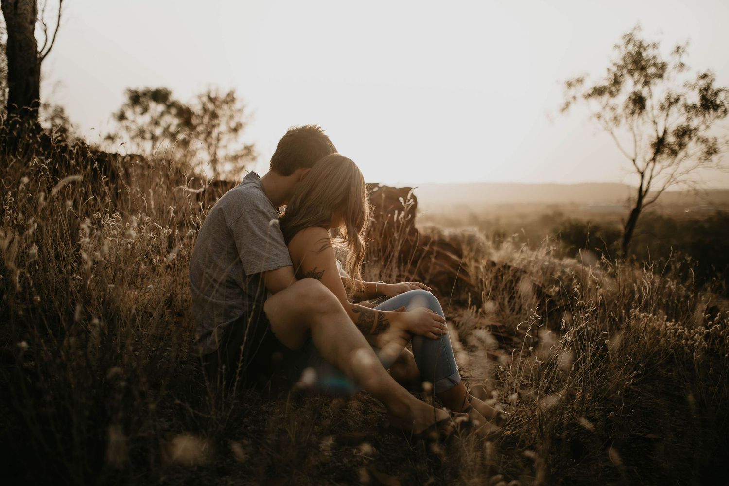 Couple photoshoot on the hill at sunset