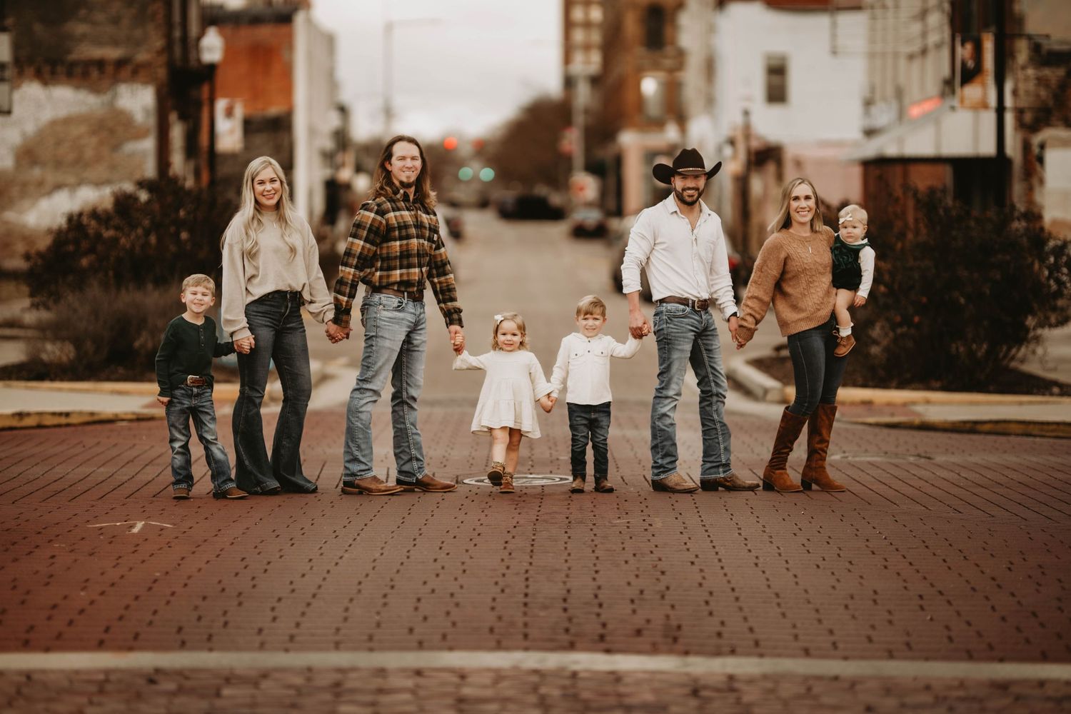 Family of five enjoying quality time together, captured in a heartfelt family photography session.