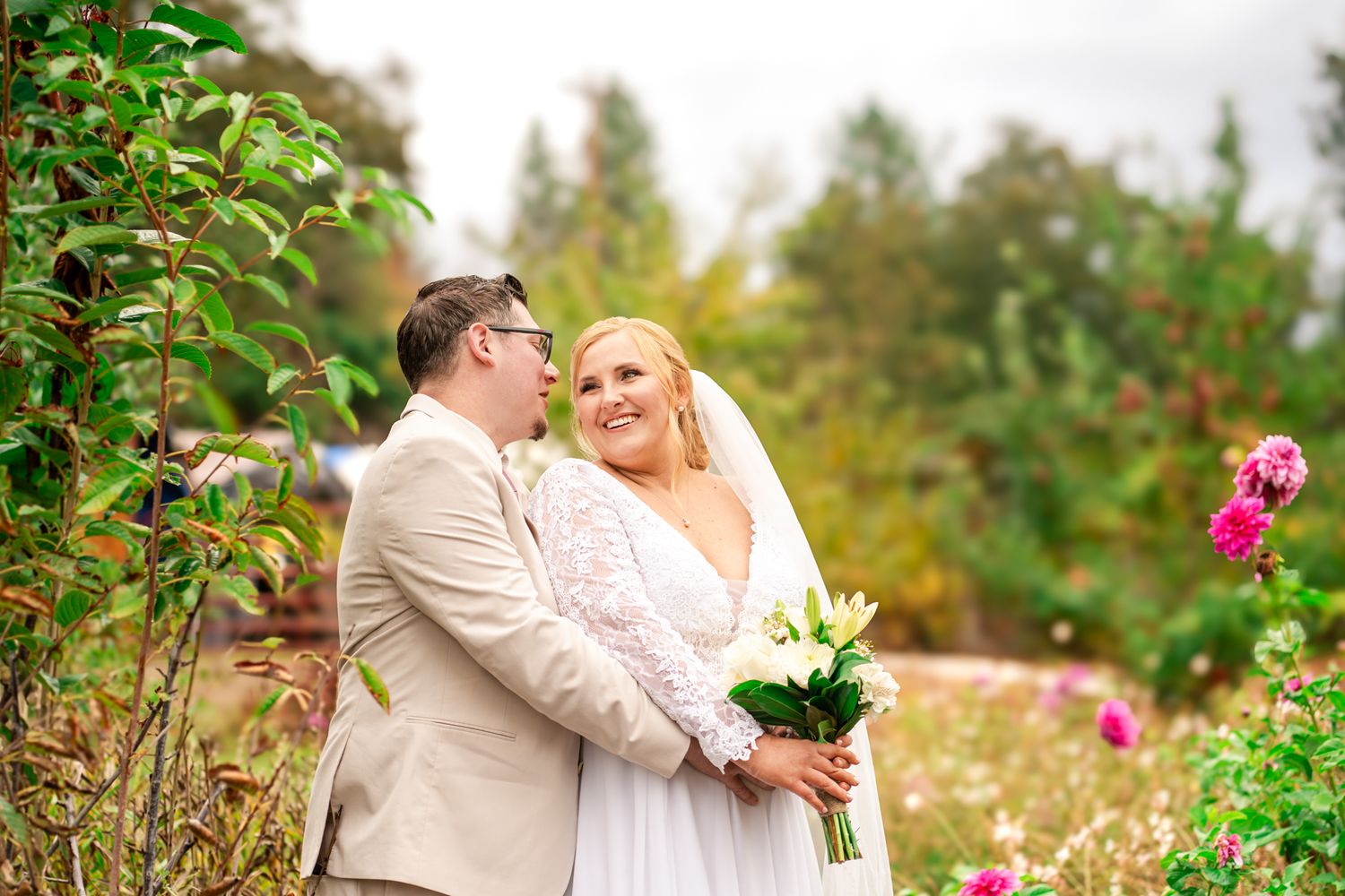 bride and groom laugh together