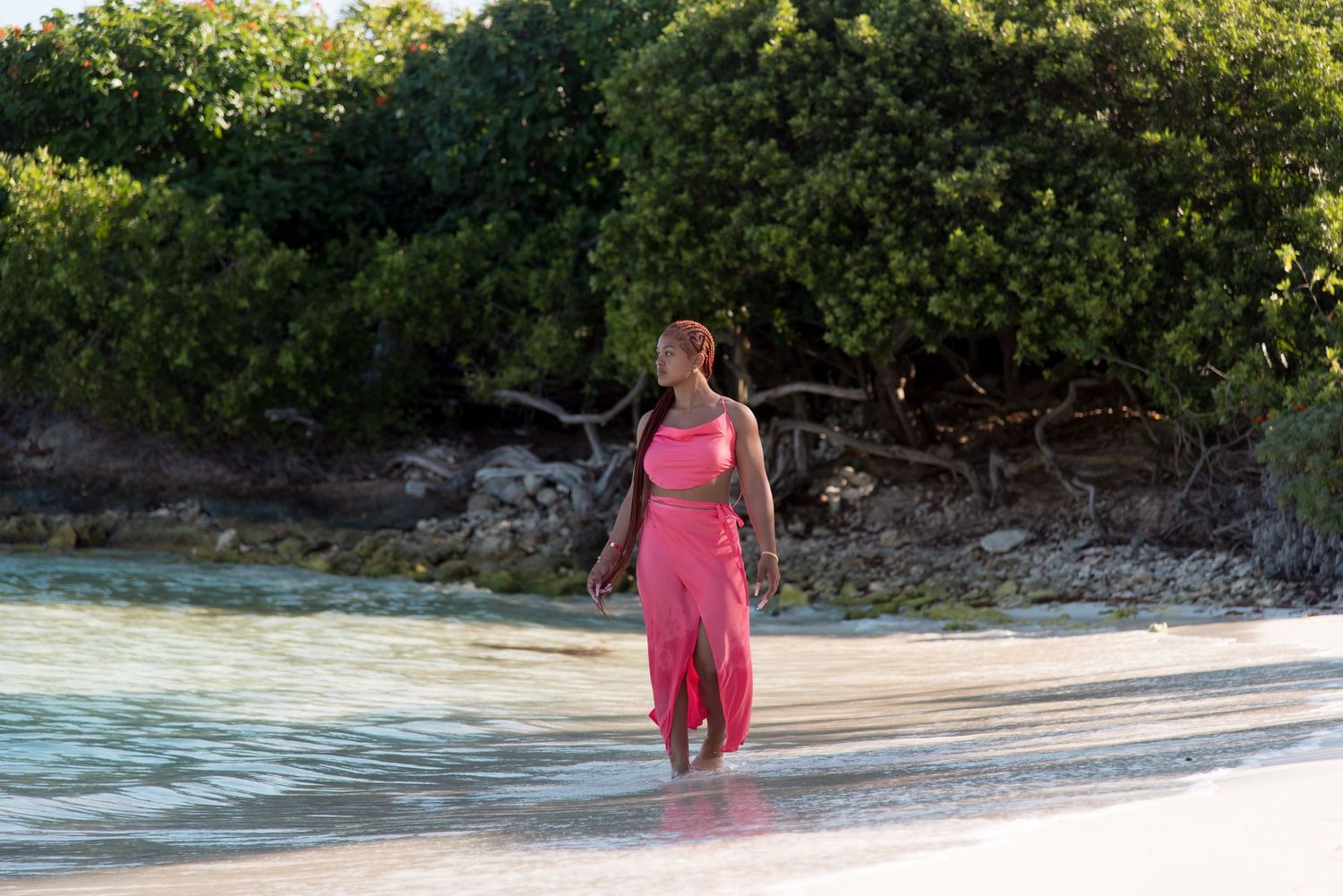 DeJean walking on the sand and enjoying the view during her Sweet-Sixteen photoshoot