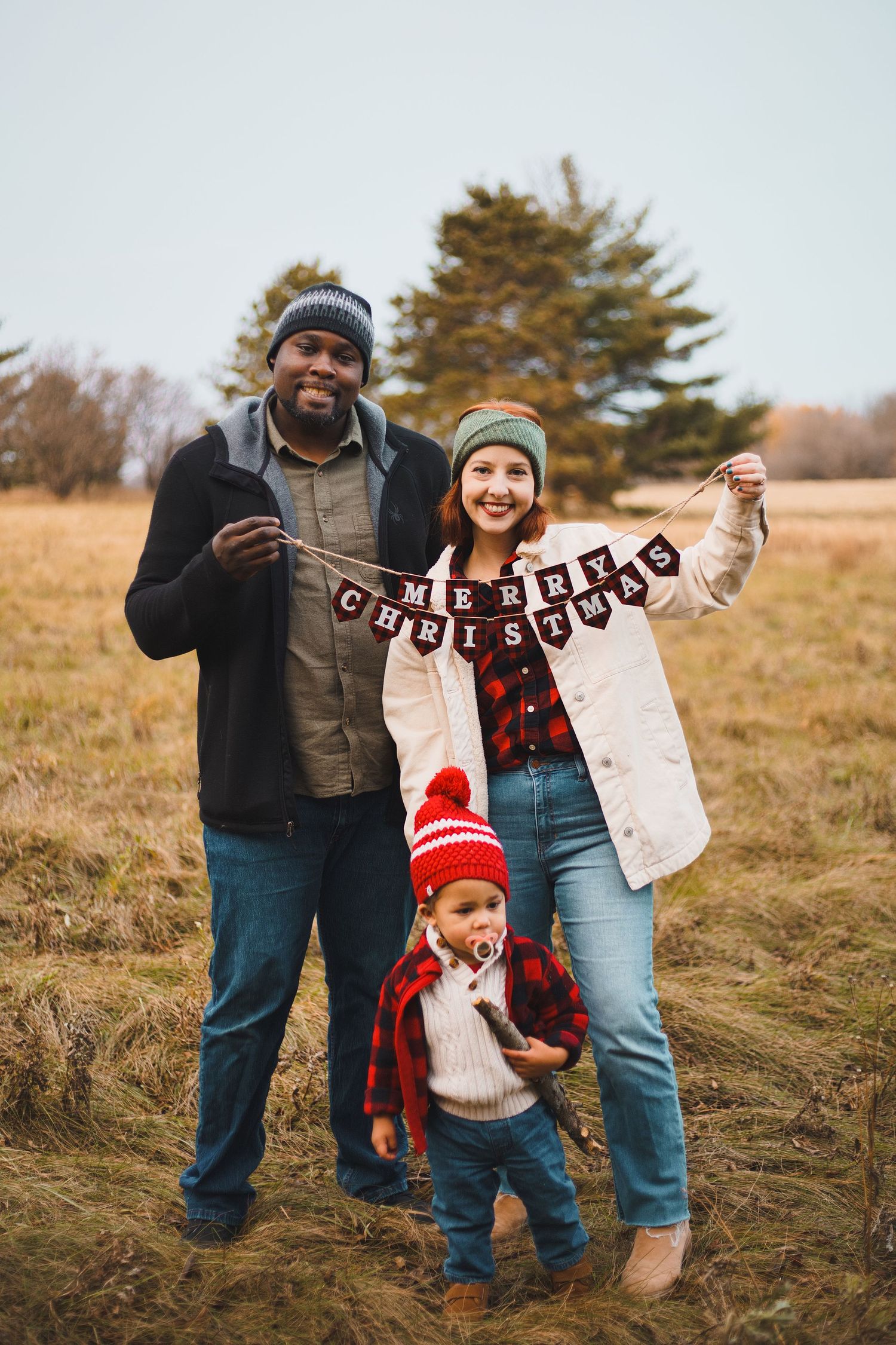 token creek county park deforest madison wi family photography christmas mini session parents holding banner