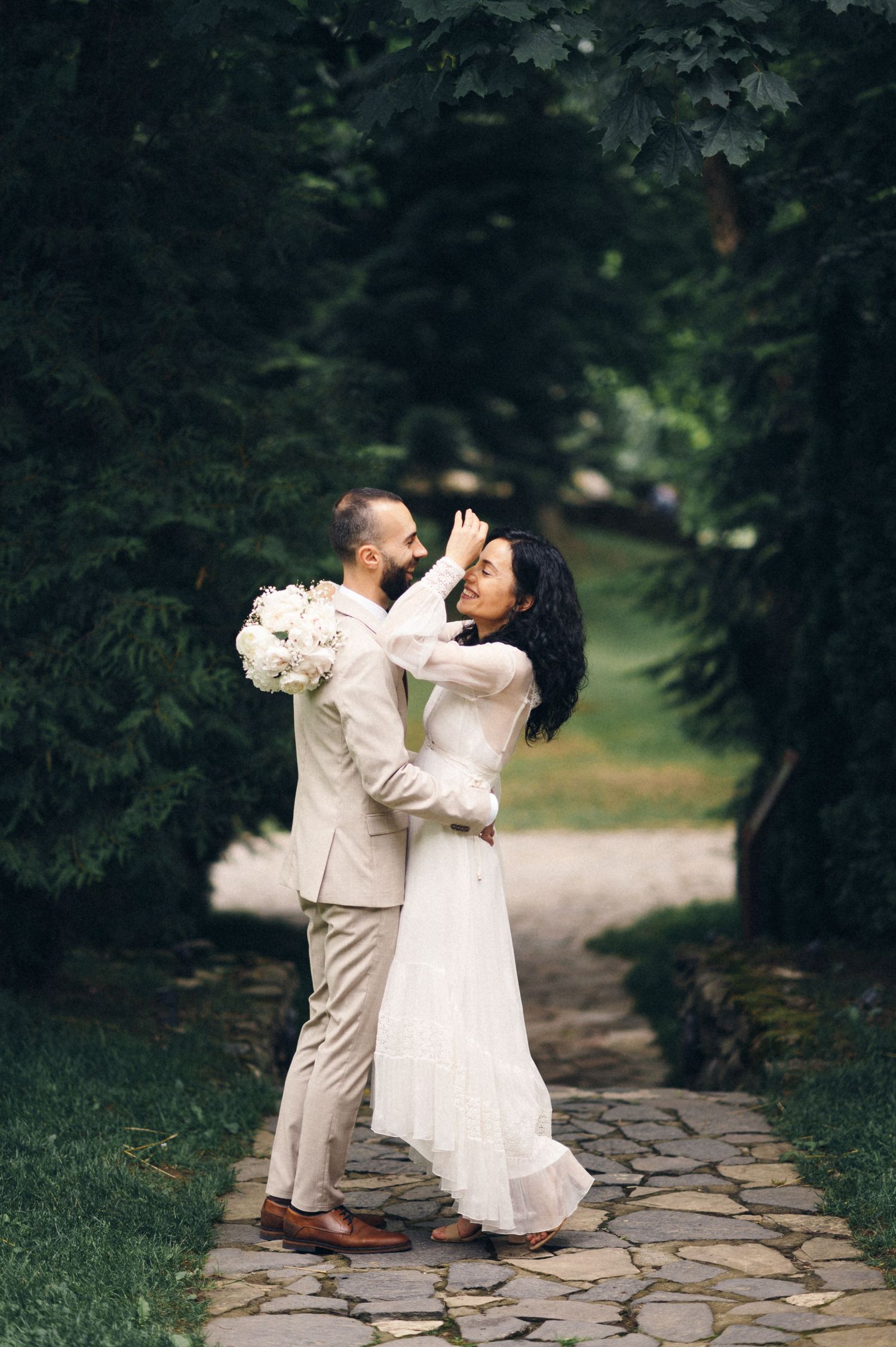 A joyful dancing moment between a couple on their wedding day.