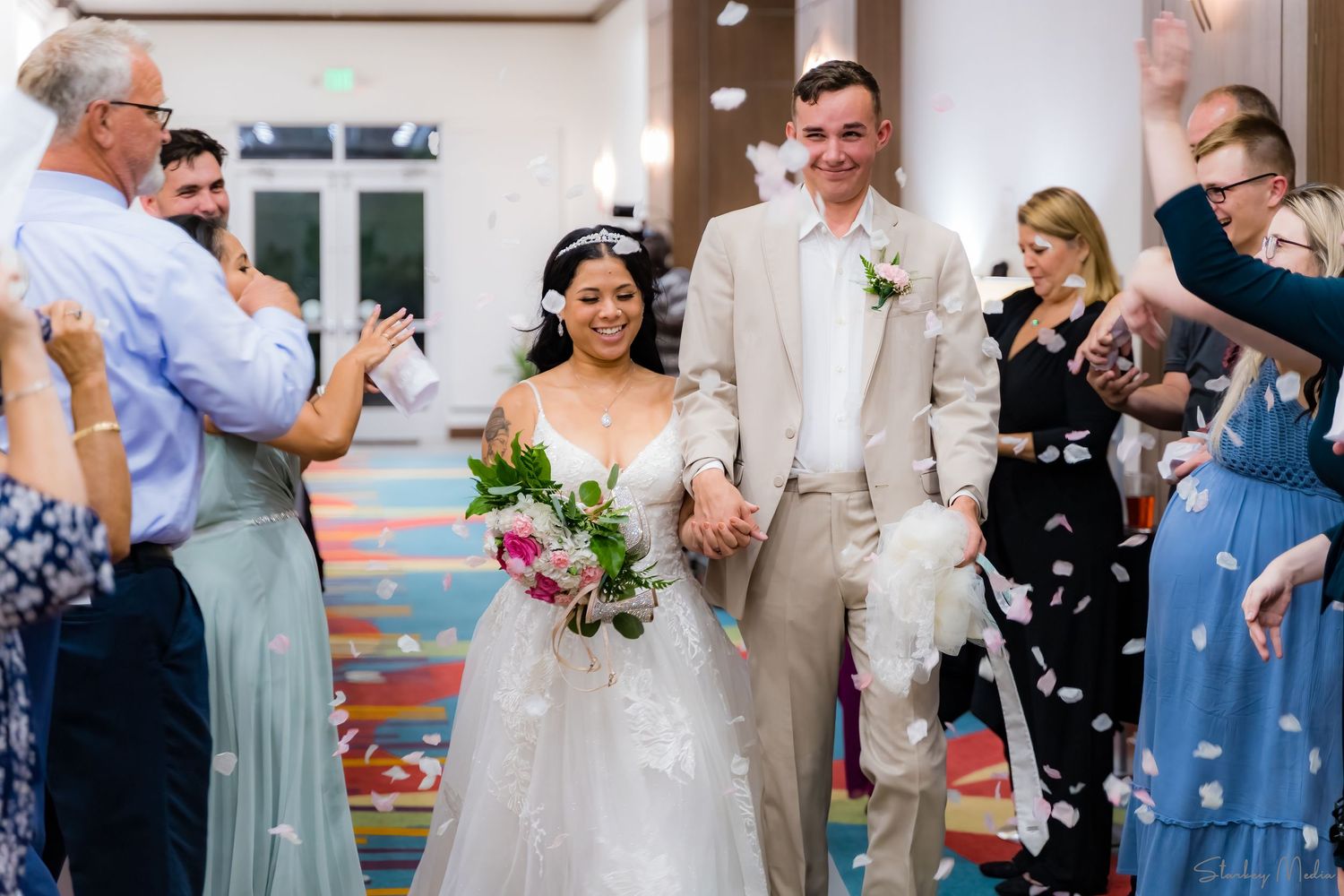 Bride and Groom walking down hall