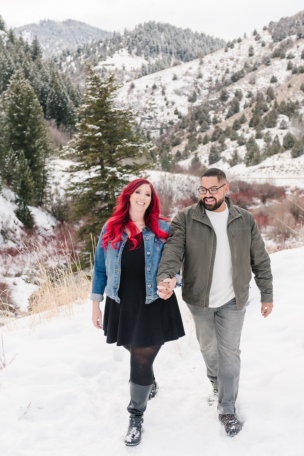 A winter walk through snowy mountain trails with evergreen trees in the background.