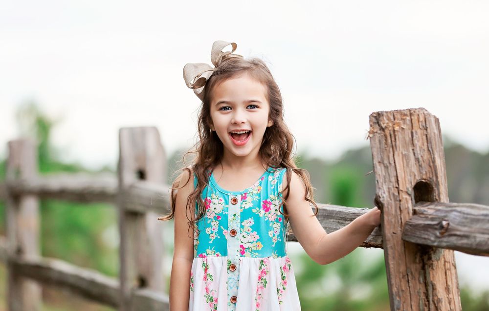 A series of close-up shots against a rustic wooden fence in natural outdoor lighting.