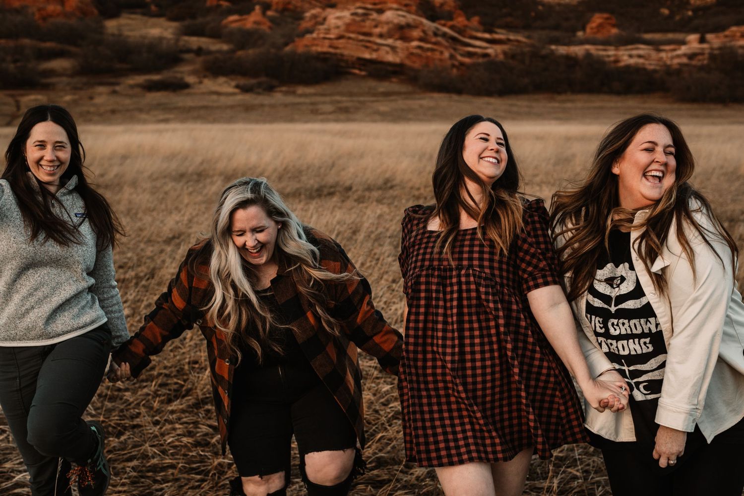 childhood friends having fun in field in Colorado by Vine Photography in Salem Ohio