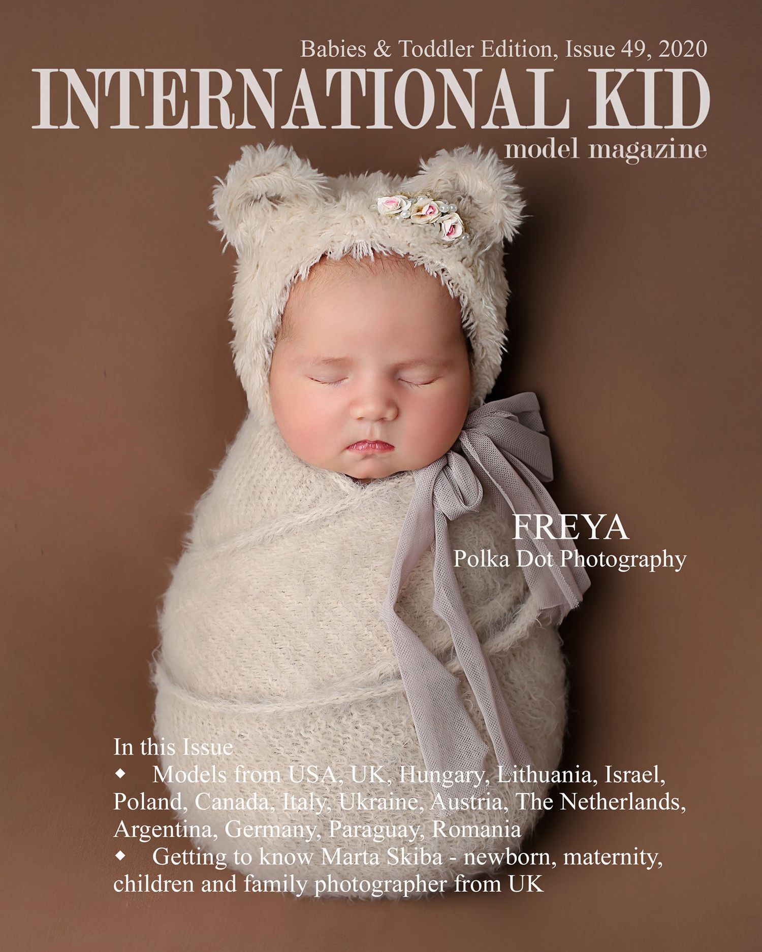 newborn baby girl swaddled wrapped in a bear hat portrait photo
