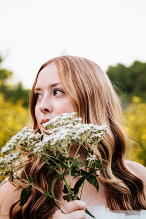 Close-up portrait series with white wildflowers creating a romantic, natural effect.