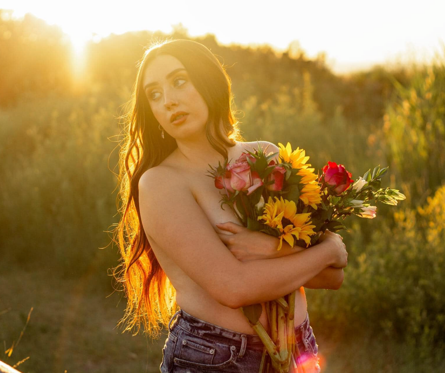 Woman holding a bouquet of flowers in the sunset sun. Taken at Tunnel Springs Park, North Salt Lake City, Utah.