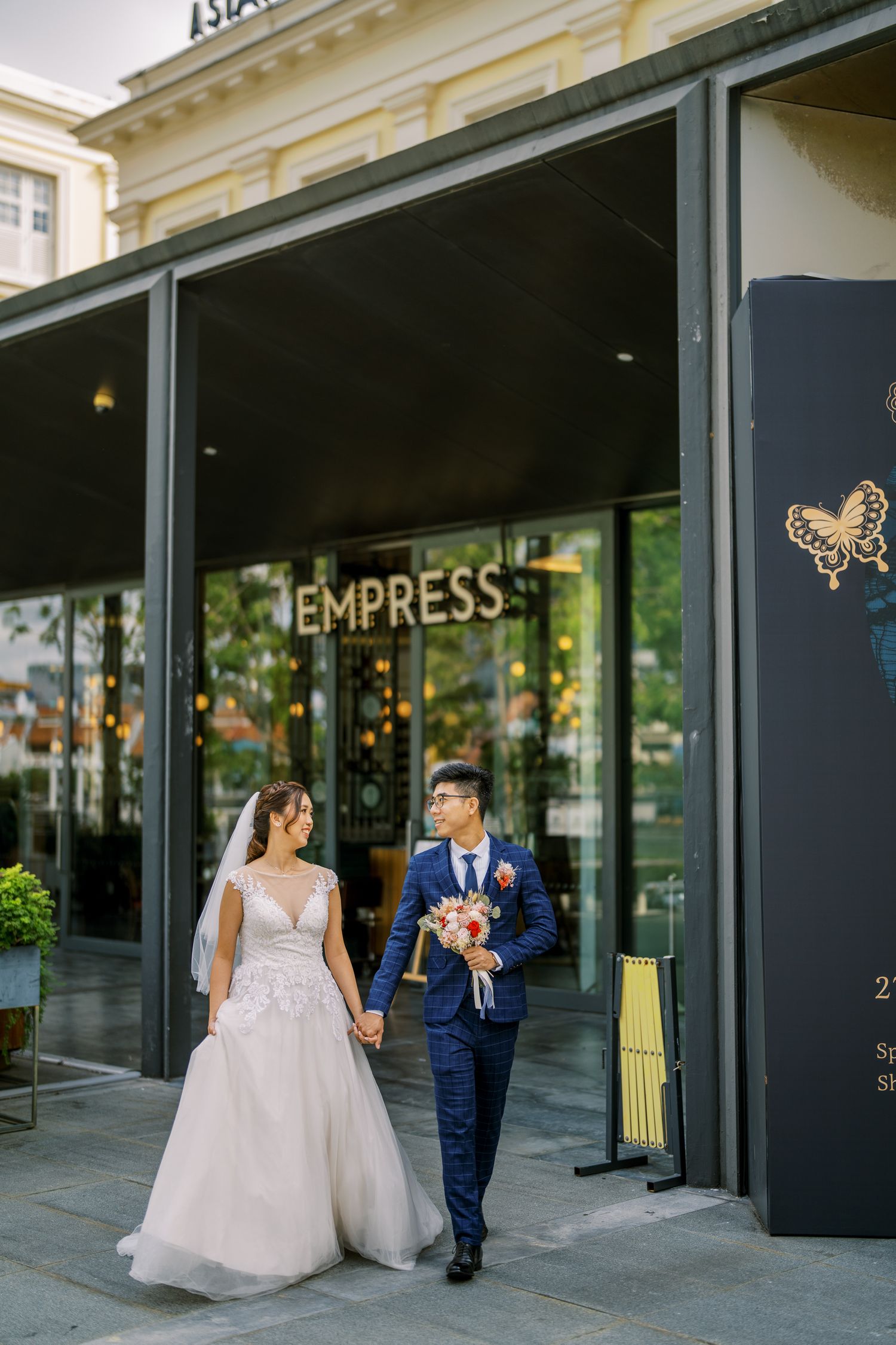 Elegant storefront of Empress restaurant with signage and glass windows.