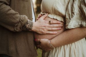 Close-up details of gentle embraces and tender moments in natural lighting.