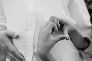 Close-up black and white detail shots highlighting tender moments.