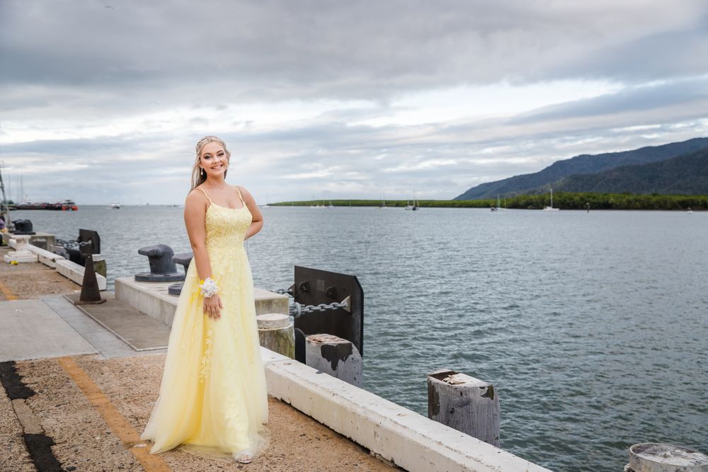 Highschool formal graduate posing at Cairns Cruise Liner Terminal
