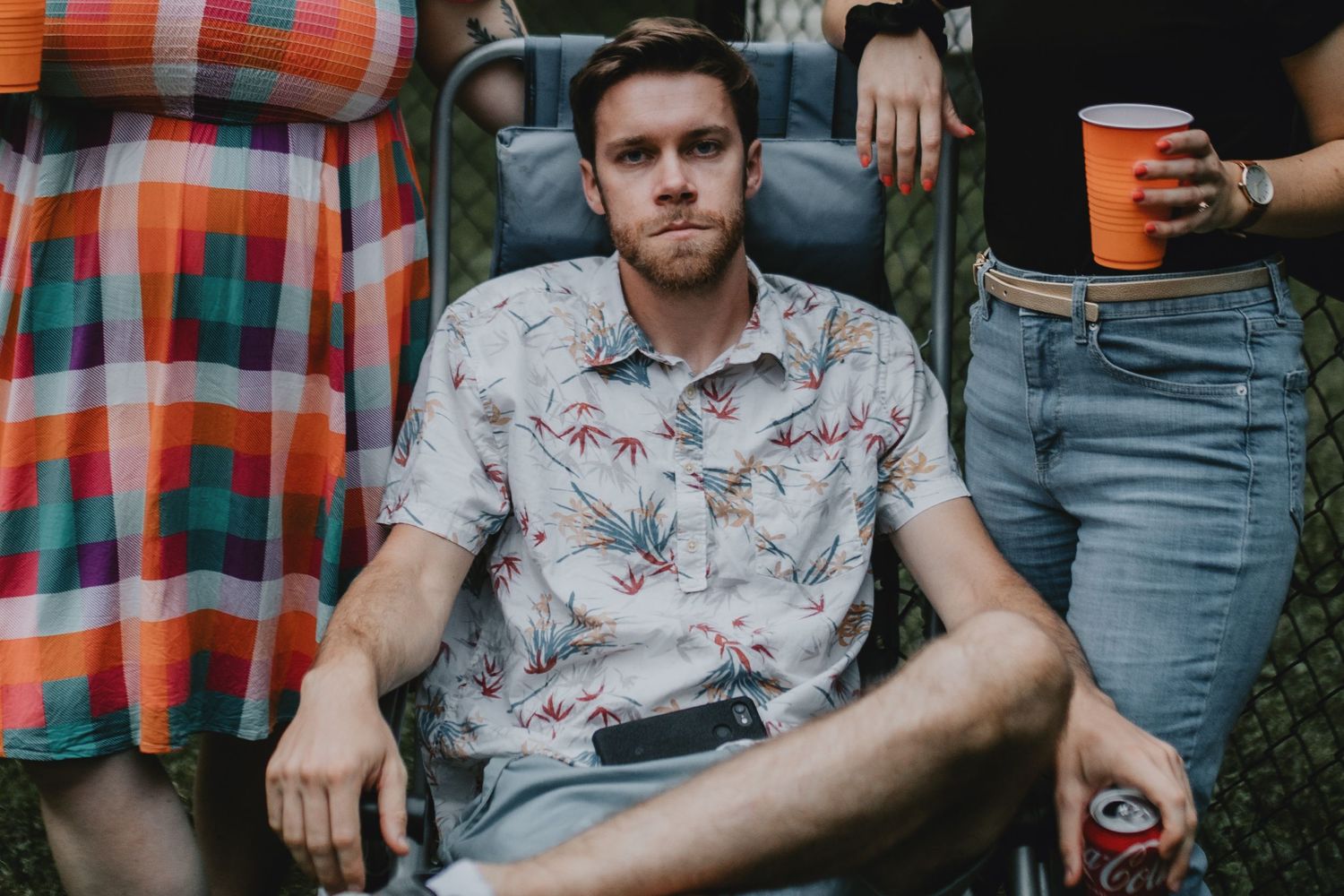 a man looking right at camera not smiling