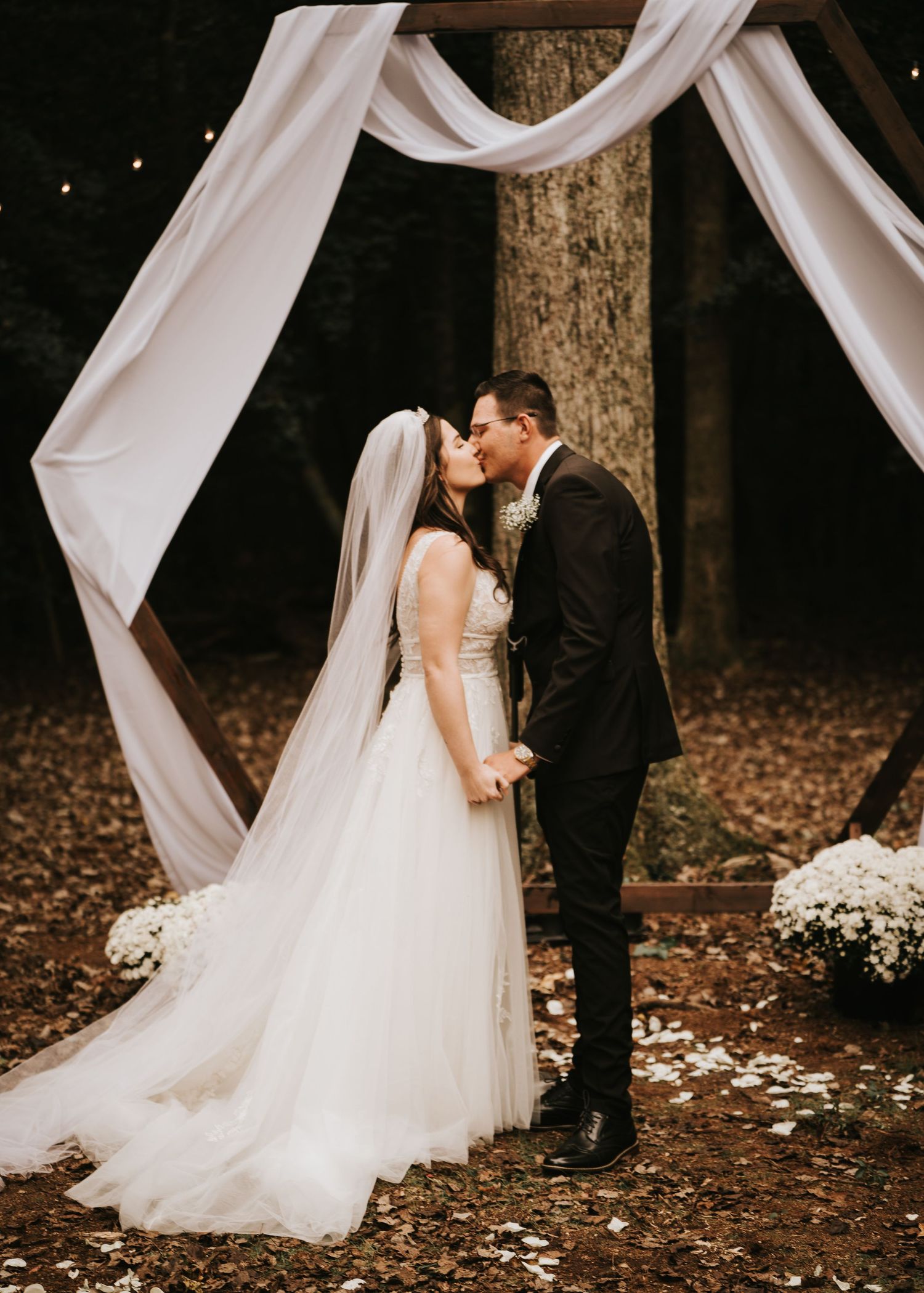 Bride and Groom Kissing Under wedding arch in Seaford Delaware