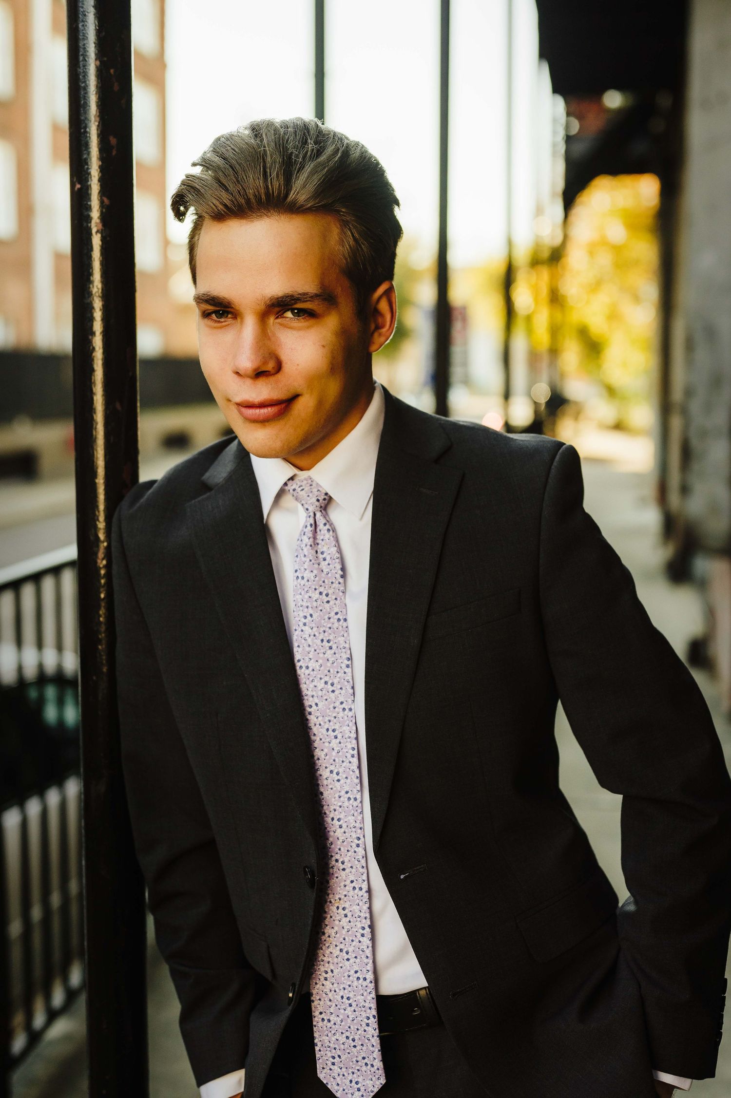 Professional portraits by windows with natural lighting.