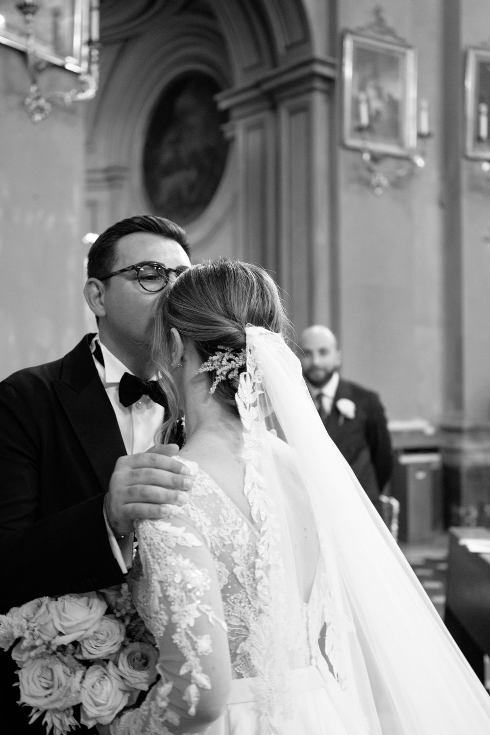 Romantic wedding portraits captured in the elegant church setting.
