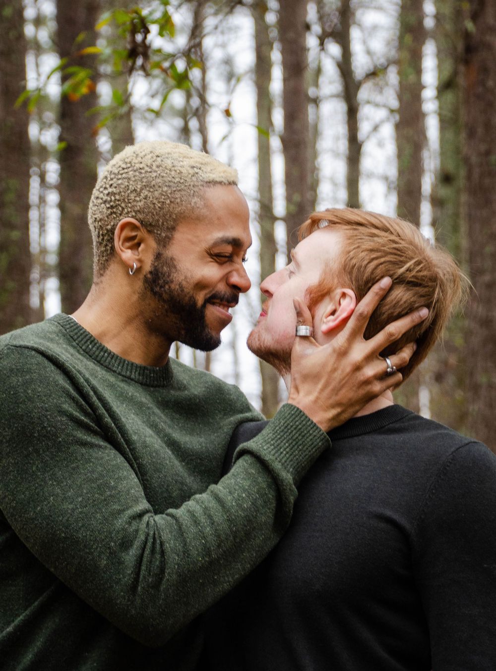 Loving couple sharing a tender moment, captured in a natural and romantic setting during a photo session