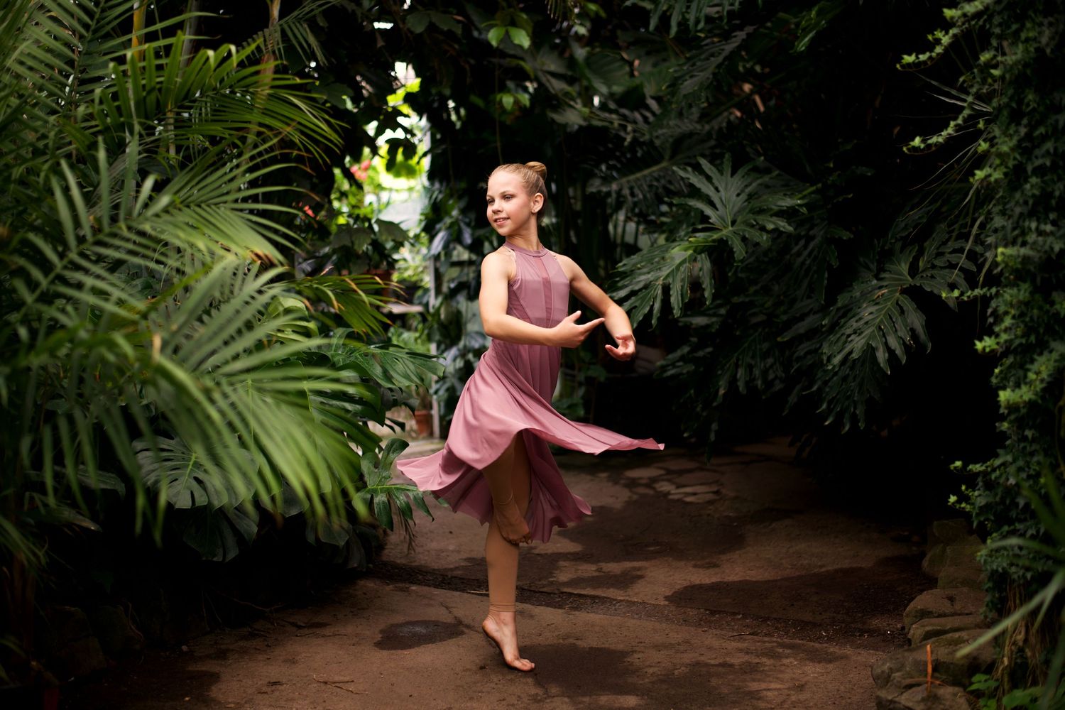 ballerina spinning in greenhouse; ballet; dance photo; greenhouse
