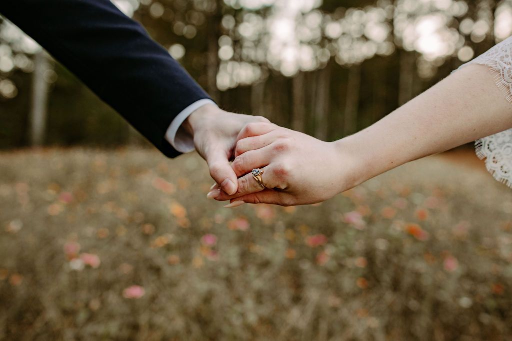Couples wedding portraits in wildflower field at Sanctuaire Atelier.