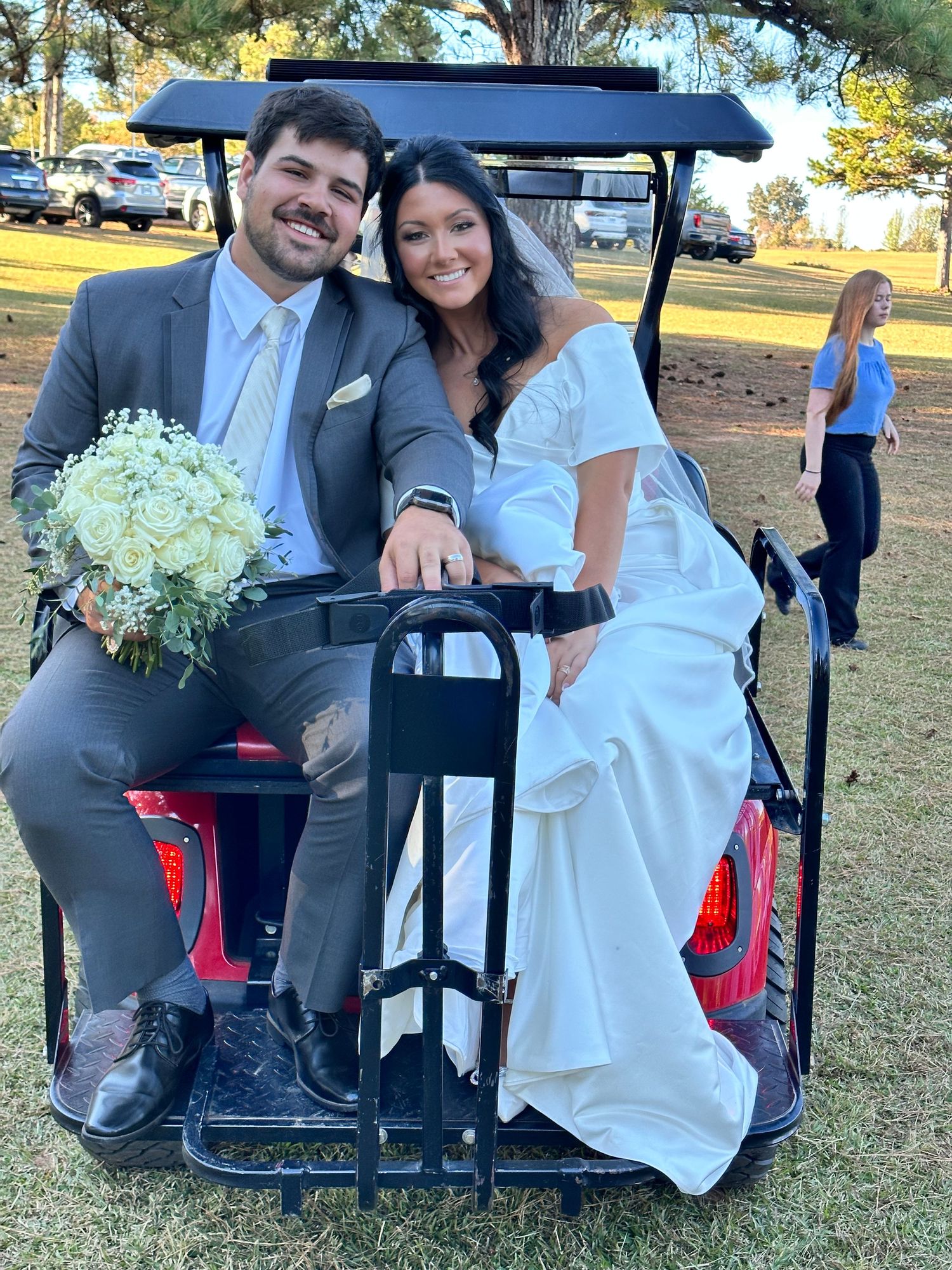 Bride and groom on golf cart after ceremony heading to the reception at Sanctuaire Atelier.