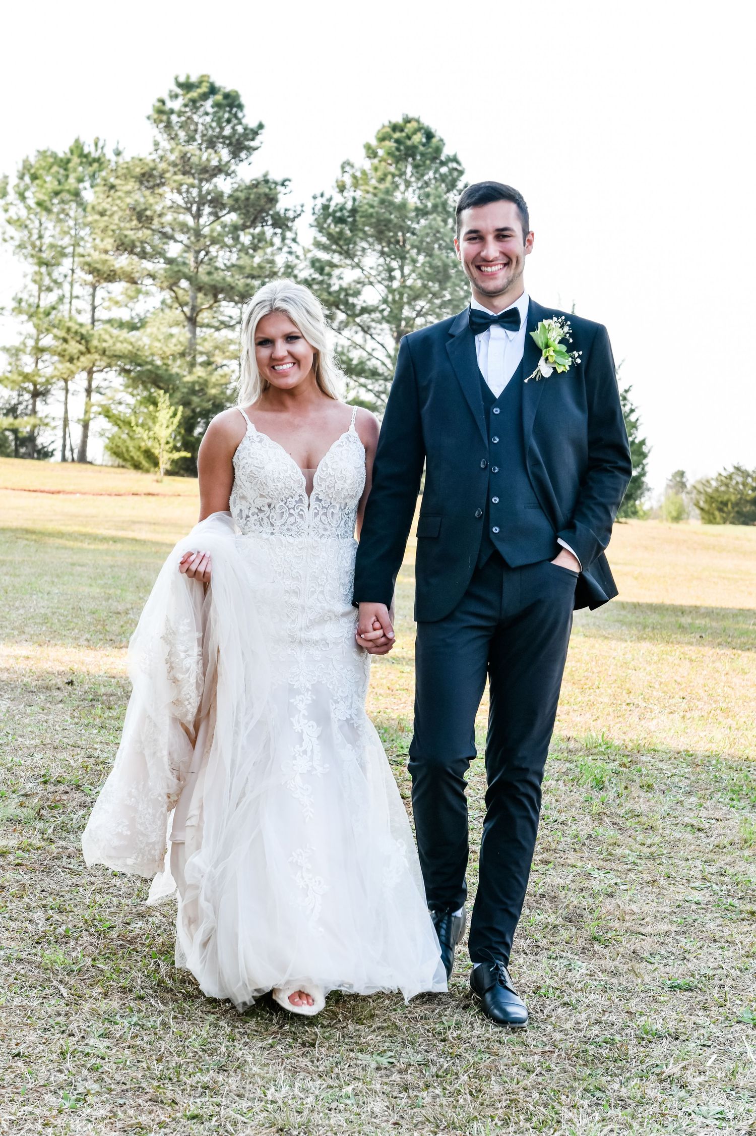 The new Mr. and Mrs. in gorgeous golden field at Sanctuaire Atelier.