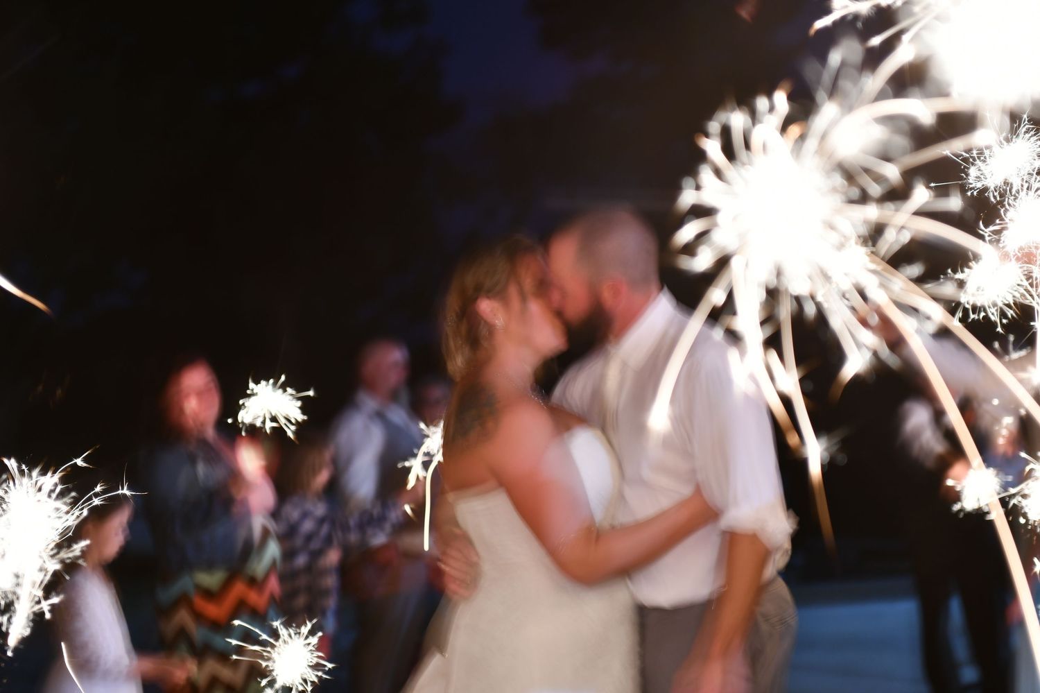 Fun couples sendoff with bright sparklers at Sanctuaire Atelier.