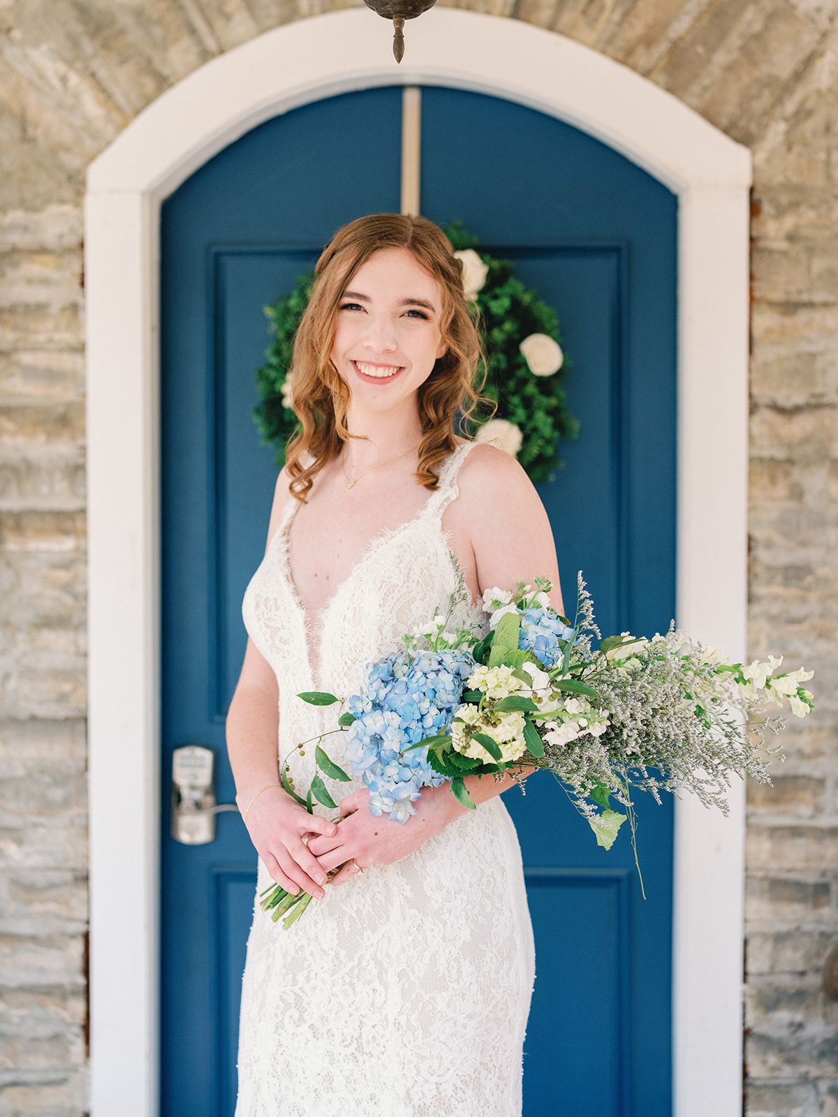 Wedding Photography: Bridal portraits in front of blue door at Honeymoon Cottage at Sanctuaire Atelier.