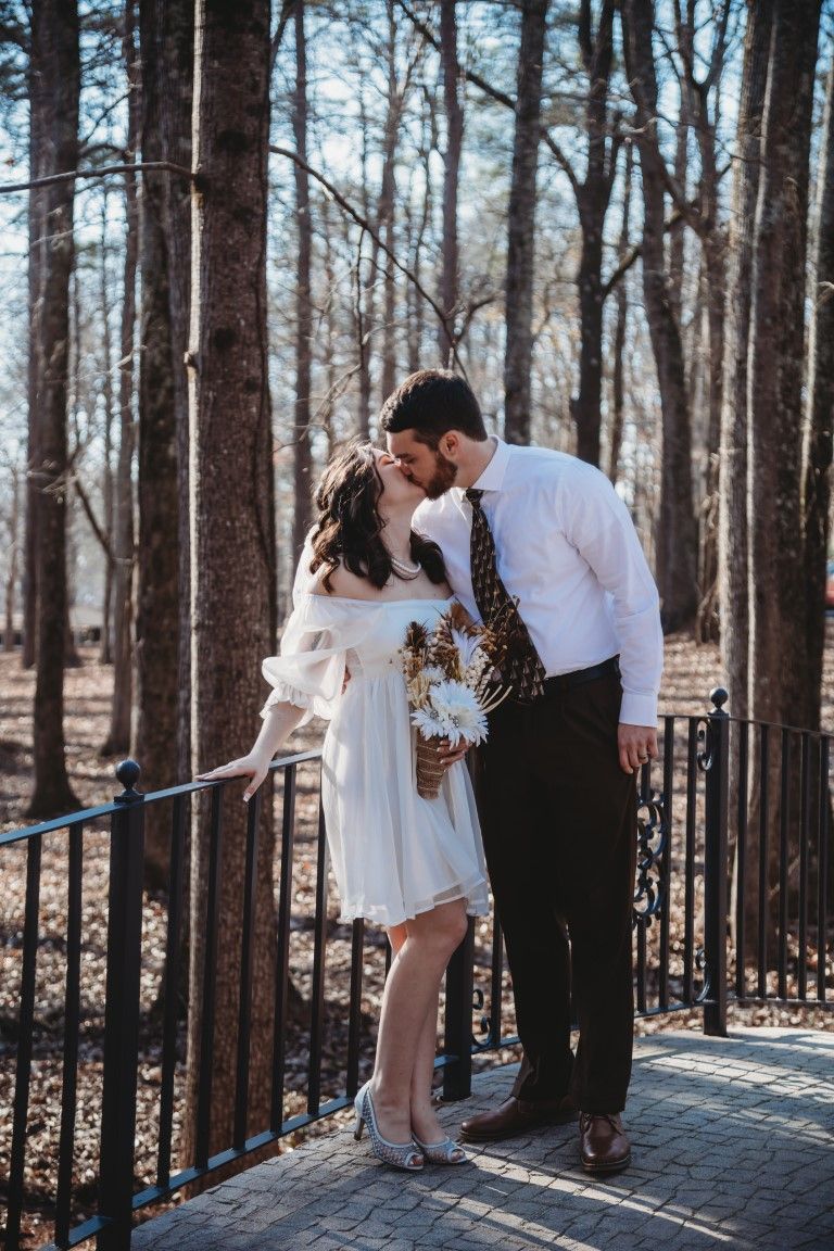 Georgia Wedding Venue: Couples wedding photoshoot on arched bridge at Sanctuaire Atelier.