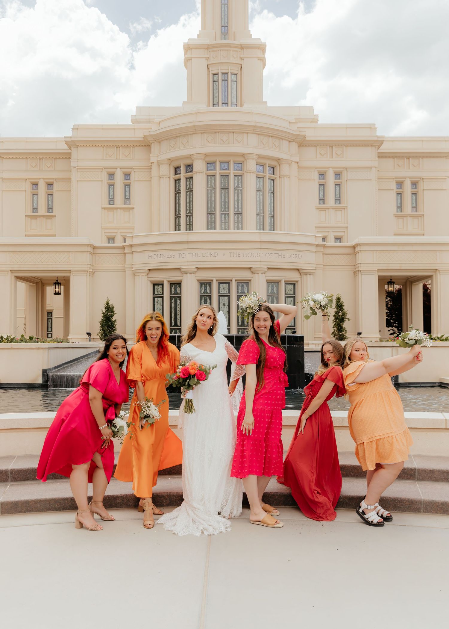Bride and Bridesmaids striking sassy pose in bright colors