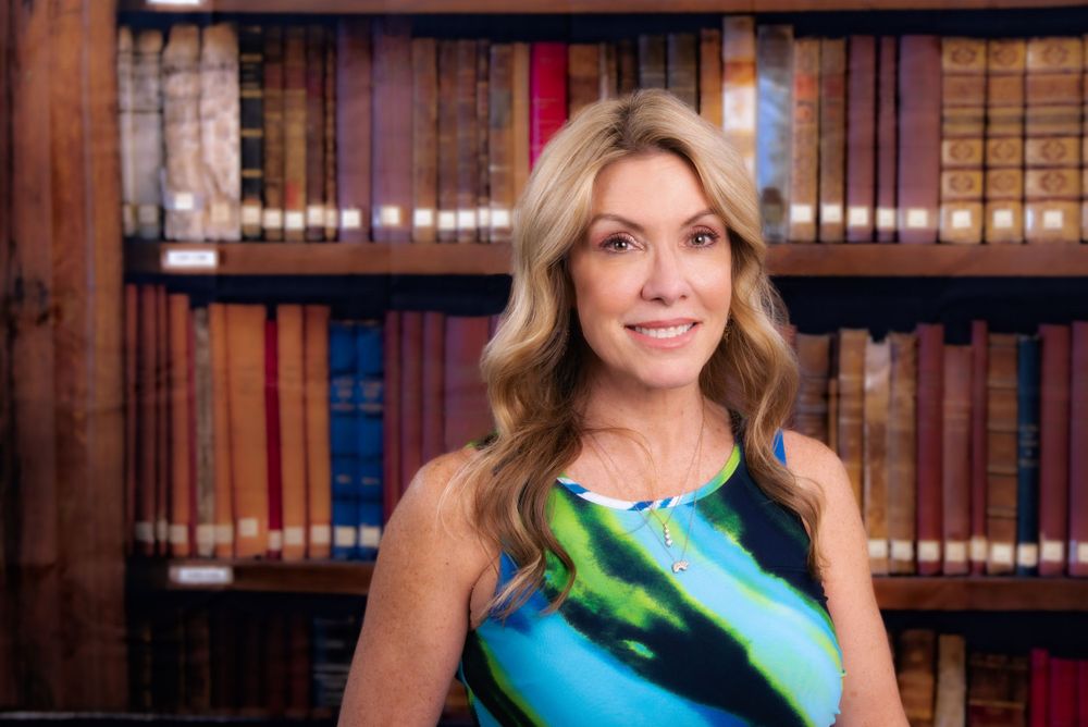 headshot with library shelf backdrop