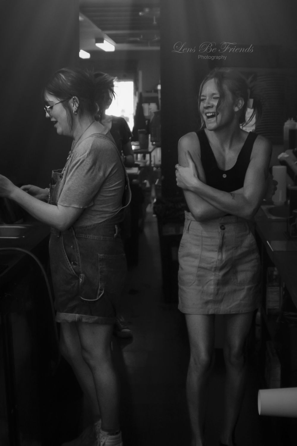 Series of monochrome images showing people dancing and enjoying themselves in a dark room.