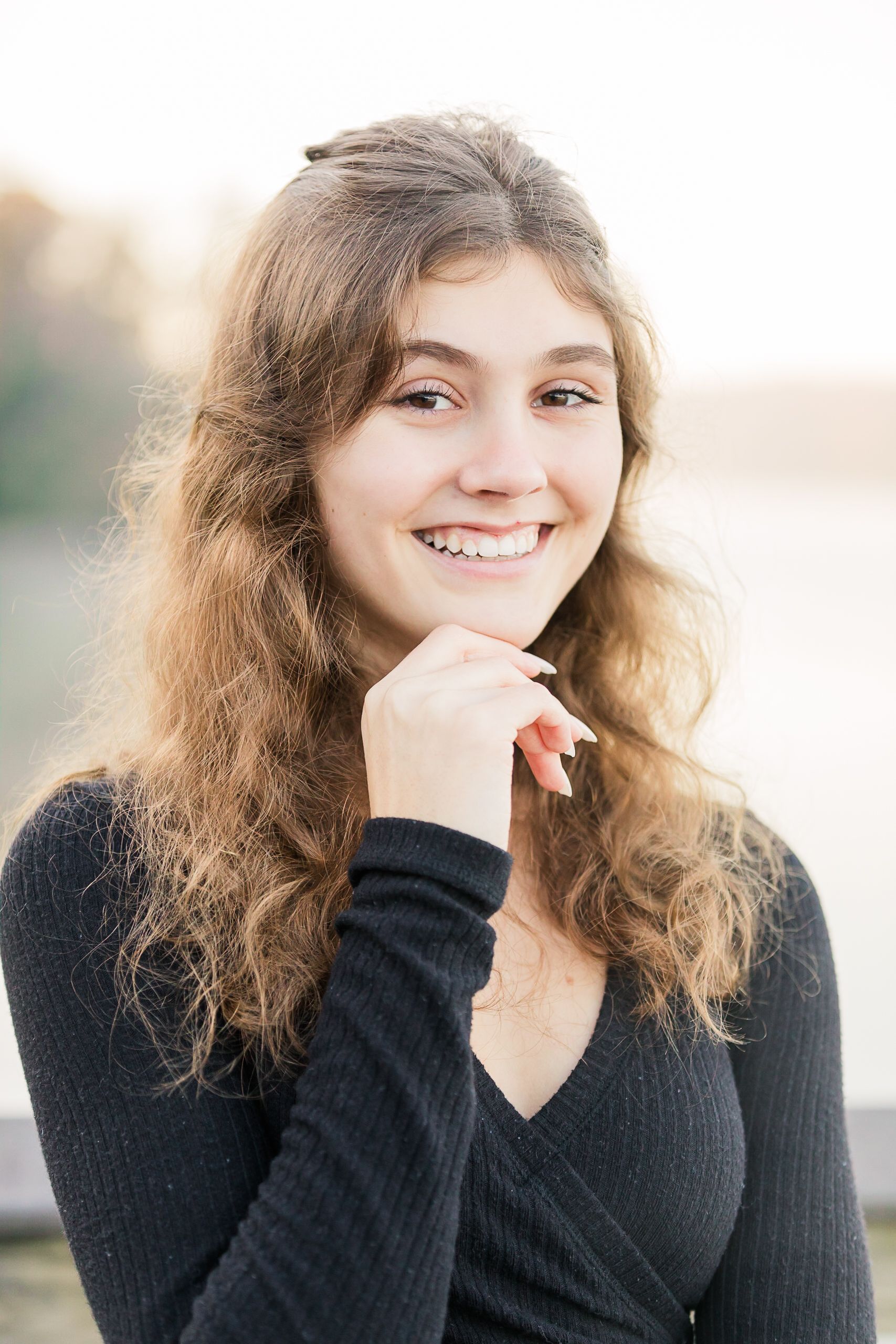 Senior girl posing with misty background