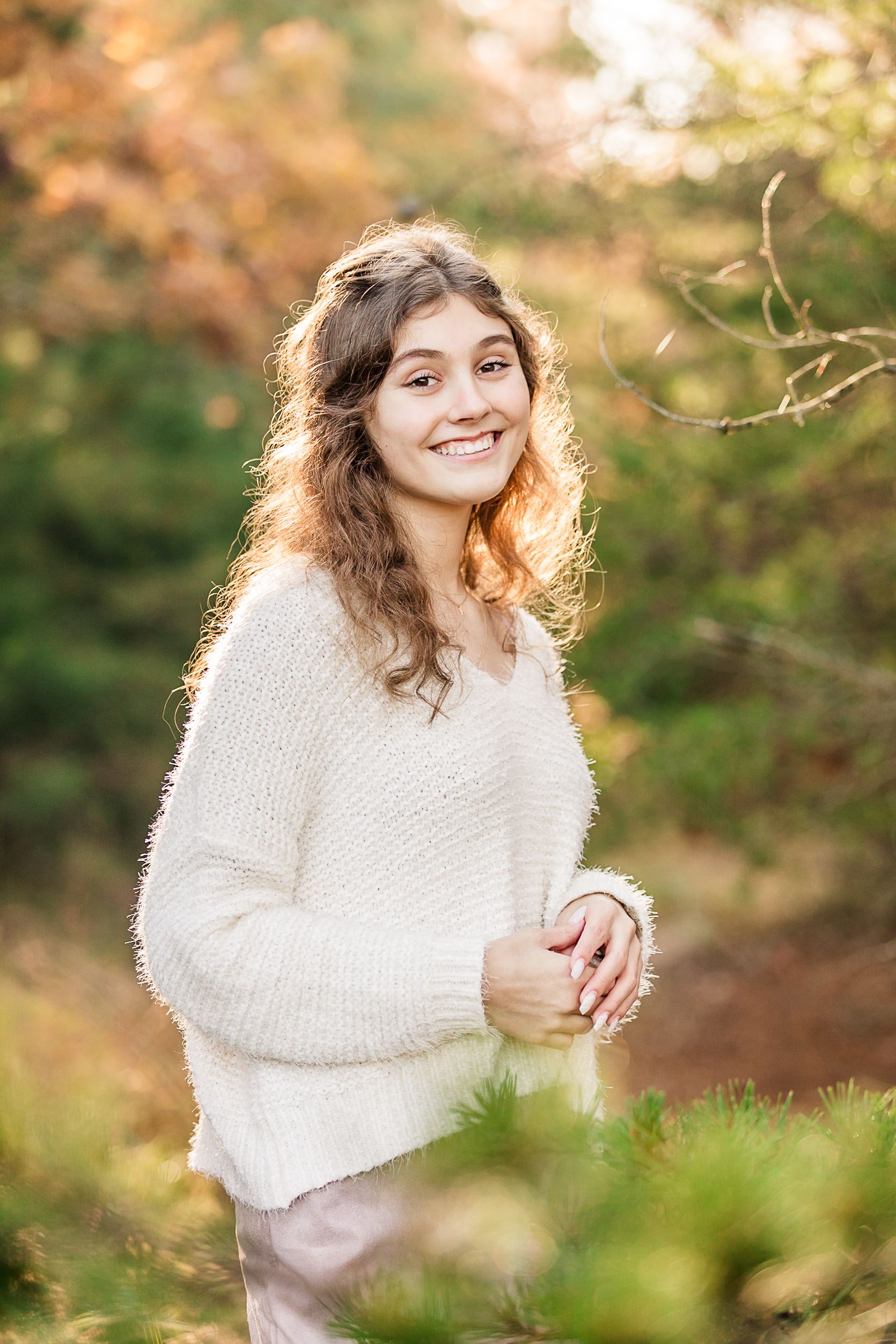 Senior girl posing in nature in fall