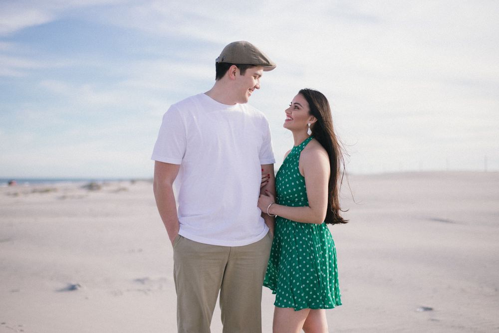 engagement couple session. looking at each other. sand. south padre island. wedding photographer