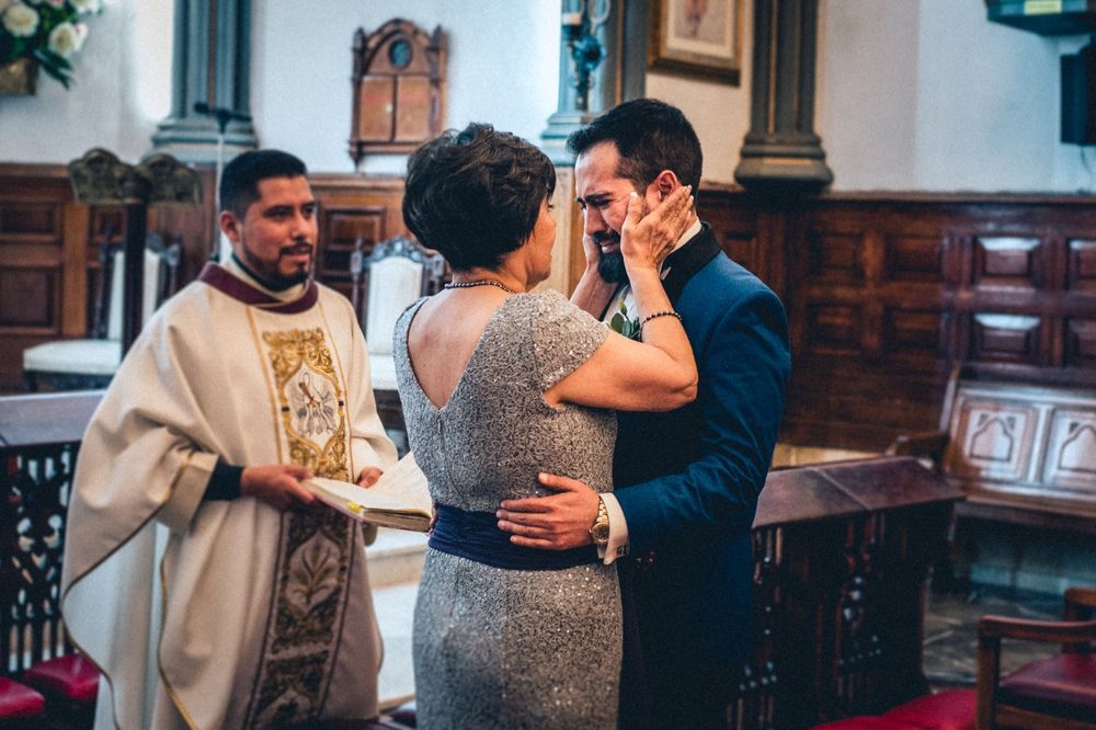 Intimate church wedding ceremony moments captured in warm lighting.