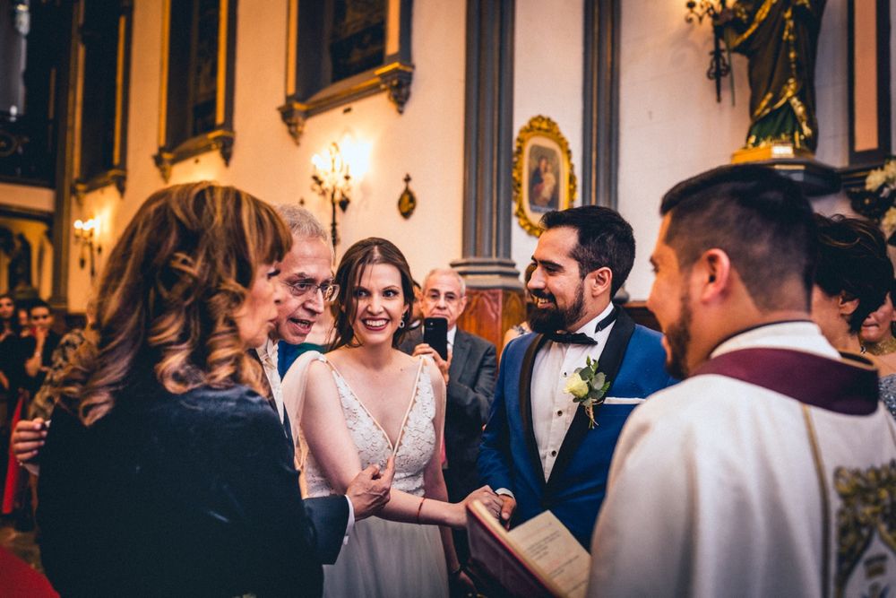 Candid reception moments captured in warm lighting with elegant decor.